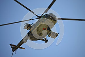 Combat helicopter flying underneath view