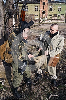 Combats checking their bags for useful stuff