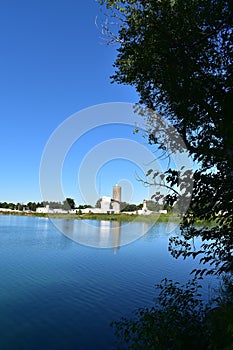 Cement factory in the background of a beautiful lake photo