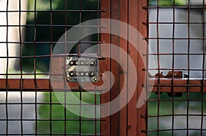 Combination lock on the door. Closed door  gate. Vintage padlock. Closed door. Security system.