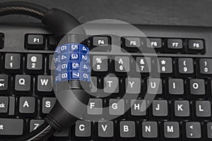Combination lock on the keyboard, close up. Cyber secure. Data protection concept