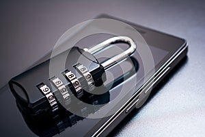 Combination Lock Lying On A Mobile Phone - App Security Concept