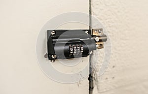 Combination padlock in a wooden door