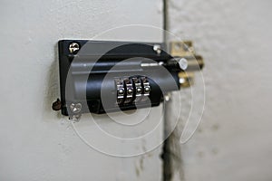 Combination padlock in a wooden door