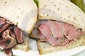 Combination pastrami corned beef on rye sandwich