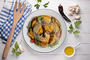 Combination plate with chicken, persimmon salad and rice. Top view table with christmas decorations.