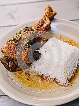 combination plate of roast lamb with white rice