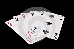 The combination of playing cards in poker on black background - Four of a Kind