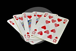 The combination of playing cards in poker on black background - Royal Flush