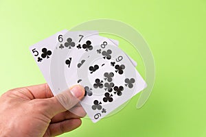 The combination of playing cards poker casino. Isolated on green background