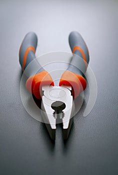 Combination Pliers Hand Tool on a Gray Background