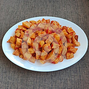 The combination of the savory potato taste with the spicy balado seasoning makes the dish richer in taste