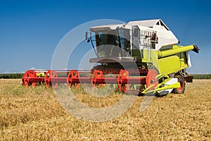 Combine in the field during grain cleaning