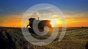 Combine, field and sunrise