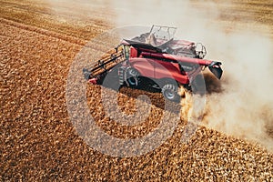 Combine harvester agriculture machine harvesting golden ripe wheat field