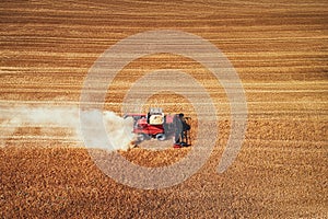 Combine harvester agriculture machine harvesting golden ripe wheat field