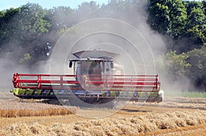 Combine harvester in the dust.