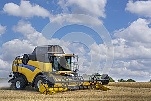 Combine-harvester in the field to gather the harvest of grain crops