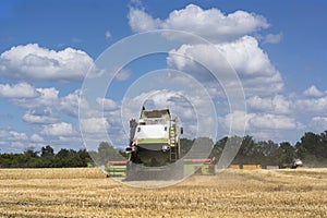 Combine-harvester in the field to gather the harvest of grain crops