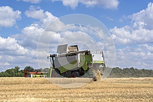 Combine-harvester in the field to gather the harvest of grain crops