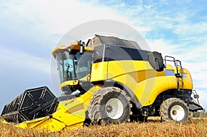 Combine harvester during field work on farm