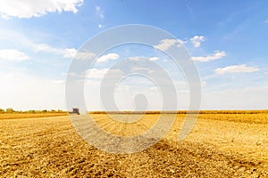 Combine harvester harvesting soybean at field