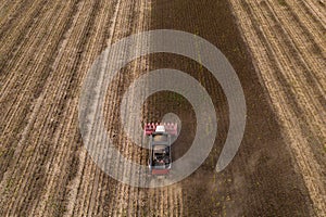 Combine harvester harvesting sunflower field