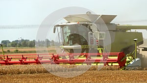 Combine Harvester Harvests Golden Wheat. Agriculture. Prores, Slow Motion