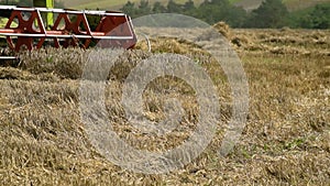 Combine harvester harvests ripe wheat. Agriculture