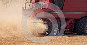 Combine harvester machine harvesting ripe golden wheat field 4K video agriculture landscape