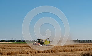 A combine harvester in the wheat field