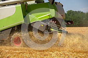 Combine harvester at work during wheat harvest. Wheat supply shortage, global food crisis, stockpiling.