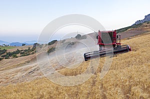 Combine harvester working on sloping ground, Spain