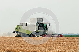 Combine harvester working on a wheat field. Harvesting wheat.