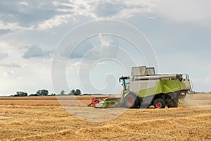Combine harvester working on a wheat field. Harvesting wheat.