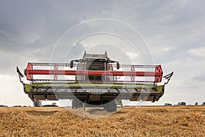 Combine harvester working on a wheat field. Harvesting wheat.