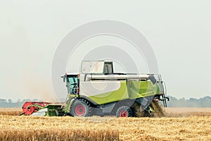 Combine harvester working on a wheat field. Harvesting wheat