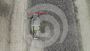 Combine harvesting rapeseed aerial view by drone