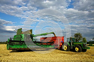 Combine machine and tractor with trailer