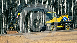 Combined road machinery - bulldozer and excavator