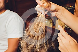 Combing with brush and pulls long hair. Daily preparation for looking nice, Long Disheveled Hair,Holding Messy Unbrushed