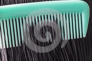 Combing healthy long straight female hair