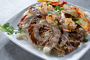 combo fried rice dish with beef shrimp and chicken