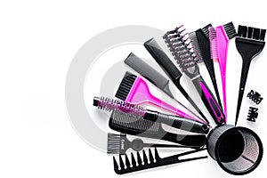 Combs and hairdresser tools in beauty salon on white background top view copyspace