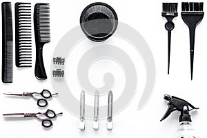 Combs and hairdresser tools in beauty salon on white background top view copyspace