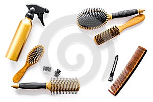 Combs and hairdresser tools in beauty salon on white background top view copyspace