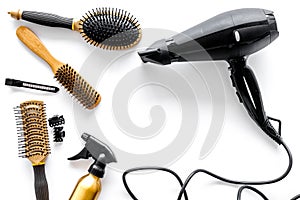 Combs and hairdresser tools in beauty salon on white background top view copyspace