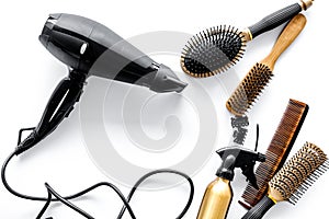 Combs and hairdresser tools in beauty salon on white background top view copyspace