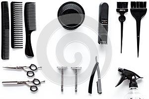 Combs and hairdresser tools in beauty salon on white background top view copyspace