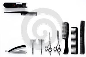 Combs and hairdresser tools in beauty salon on white background top view copyspace